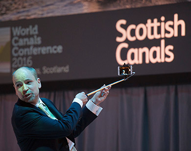 Richard Millar takes a selfie with delegates during the opening session of the WCC 